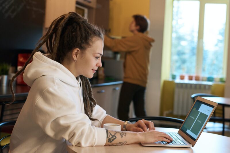 shallow-focus-photo-of-woman-using-a-laptop