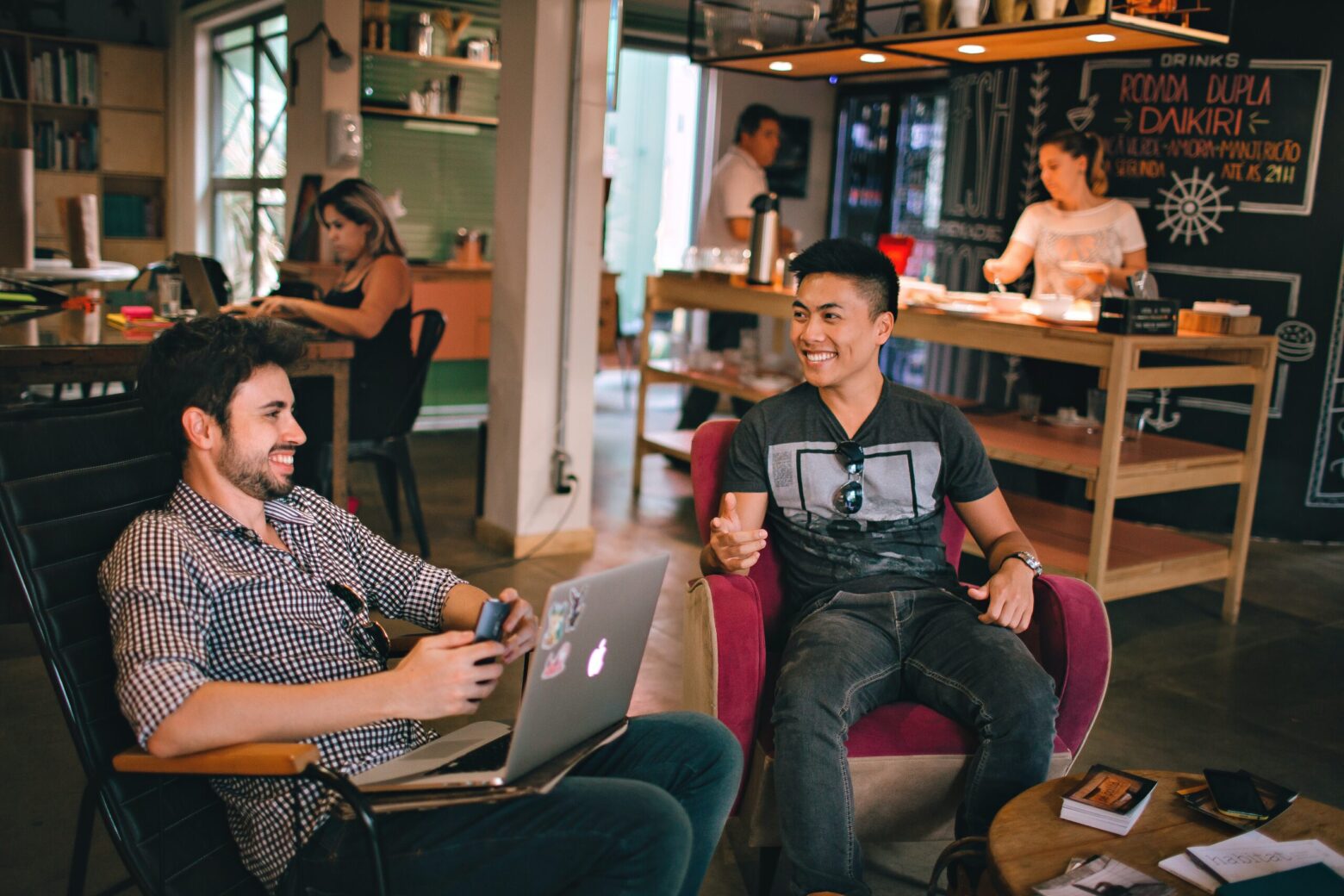 photograph-of-men-having-conversation-seating-on-chair