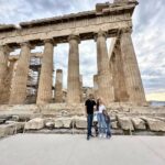 Kailah and Kyle Fredette with their two young daughters in front of the Parthenon on the Acropolis in Athens