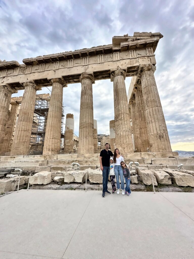Kailah and Kyle Fredette with their two young daughters in front of the Parthenon on the Acropolis in Athens