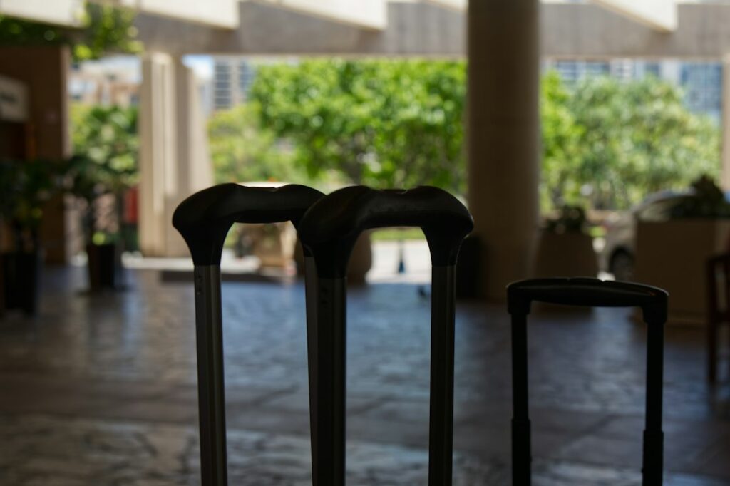 Three suitcases waiting in a hotel lobby for luggage storage